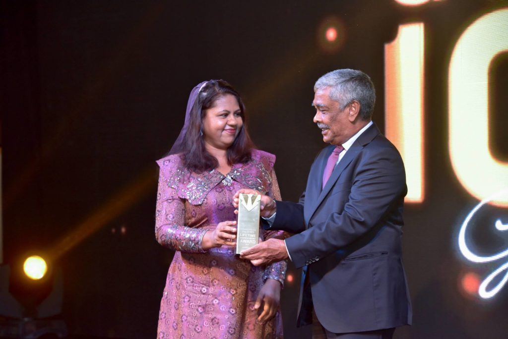 Crown and Champa Resorts Chairman Champa Hussain Afeef receives GOLD 100 Lifetime Achievement Award from then Governor of MMA Dr. Azeema Adam 